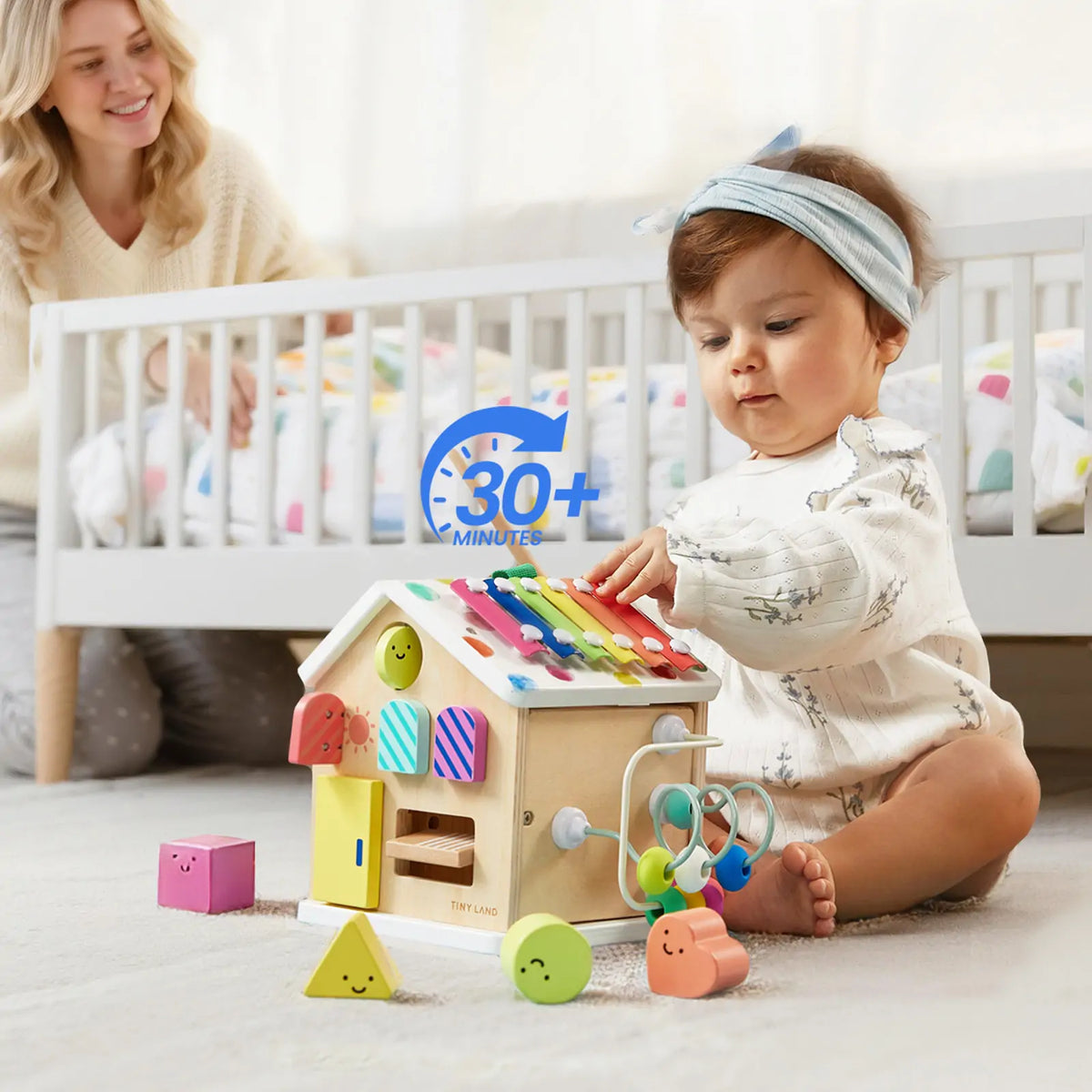 Colorful Tiny Land® Cottage Activity Cube featuring rainbow design with interactive shapes and activities for children.