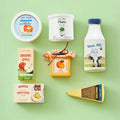 Tiny Land® Organic Dairy Pack play food set featuring miniature milk bottles and dairy products for kids' pretend play.
