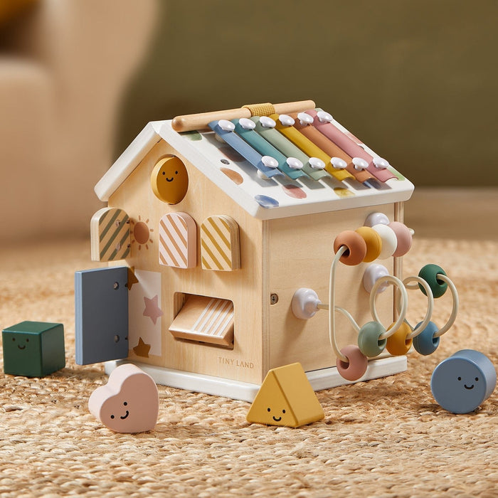 Tiny Land® Cottage Activity Cube in Morandi colors, featuring colorful blocks, doors, and interactive elements for children.