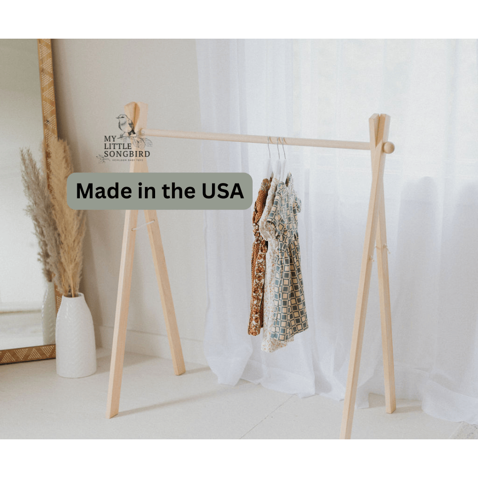 Wooden toddler clothes rack from ShopMyLittleSongbird, sturdy wooden toy organizer for children's dresses and clothing.