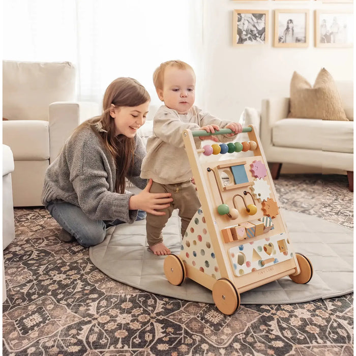 Tiny Land® natural wooden baby walker with four wheels and a sturdy handle, designed for early walking support.
