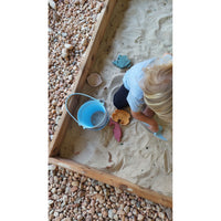 Colorful silicone sand bucket toy with shovel and toys, perfect for kids' outdoor play and sandcastle building.