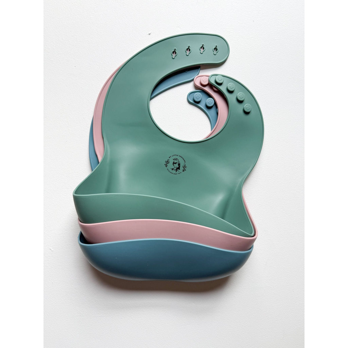 Silicone bib by ShopMyLittleSongbird with adjustable neck strap and food-resistant design, ideal for young children.