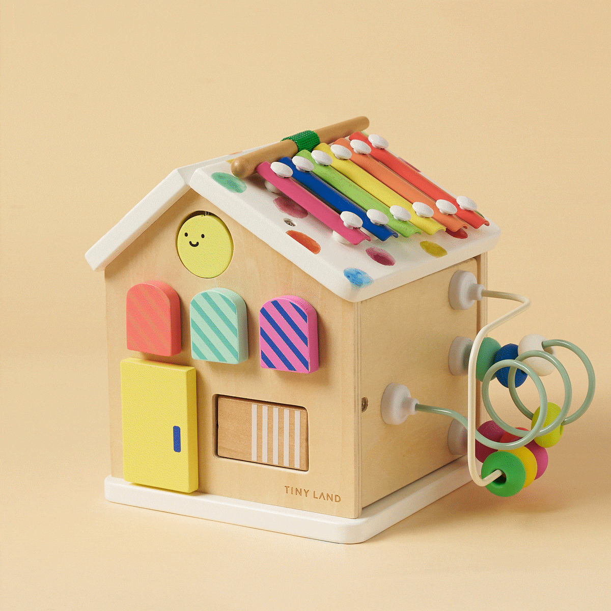 Colorful Tiny Land® Cottage Activity Cube with rainbow design, featuring interactive toys for toddlers and early childhood play.
