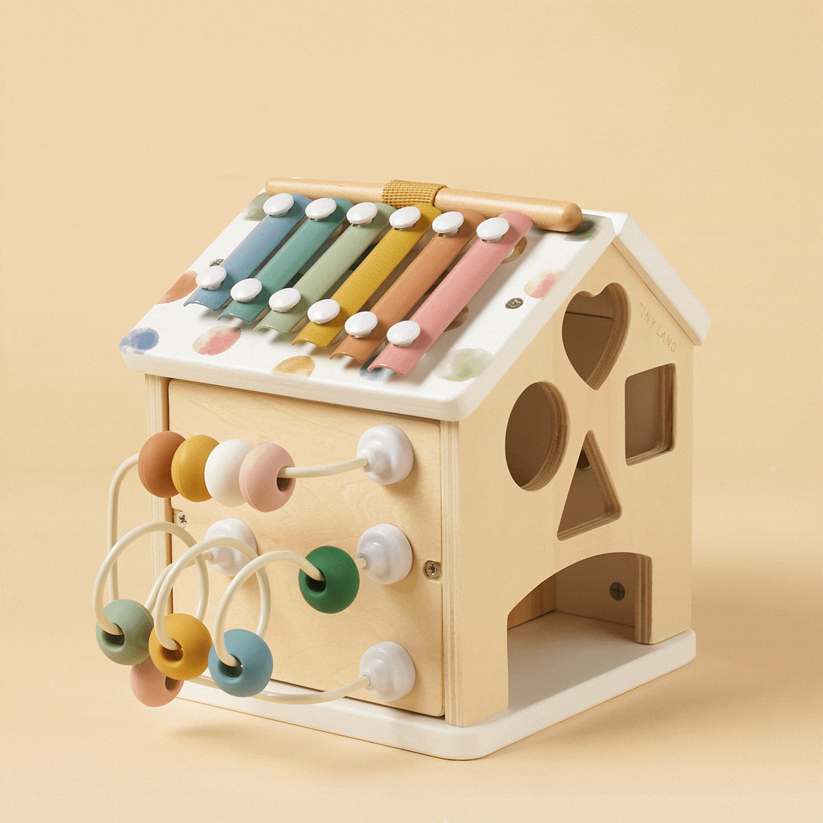 Tiny Land® Cottage Activity Cube in Morandi with colorful blocks, doors, and windows for imaginative play and development.