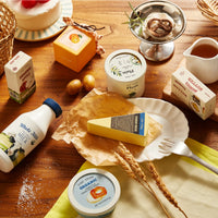 Tiny Land Organic Dairy Pack play food set with miniature milk bottles and dairy products by Tiny Land INC.
