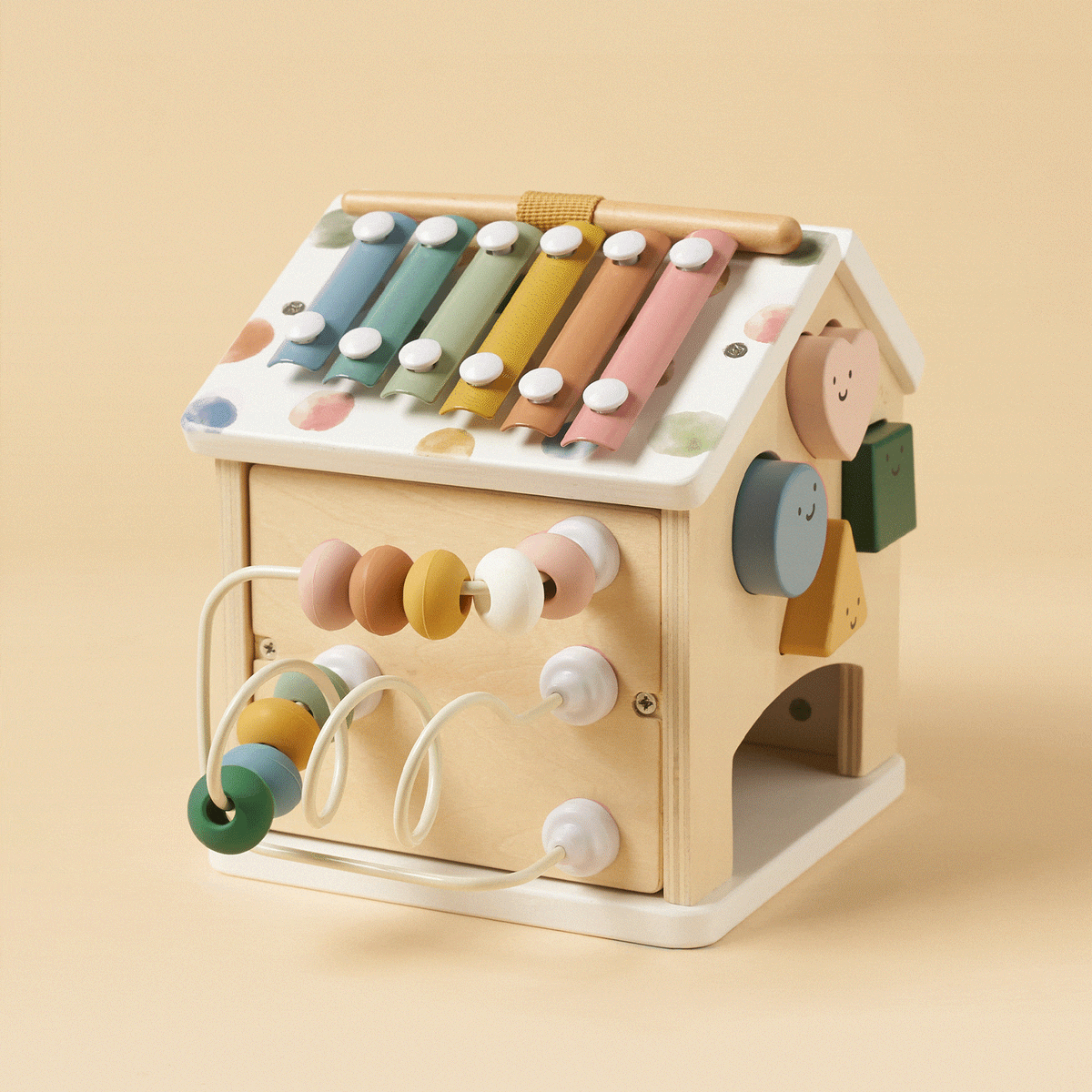 Tiny Land® Cottage Activity Cube in Morandi colors with various sensory and educational features for children.