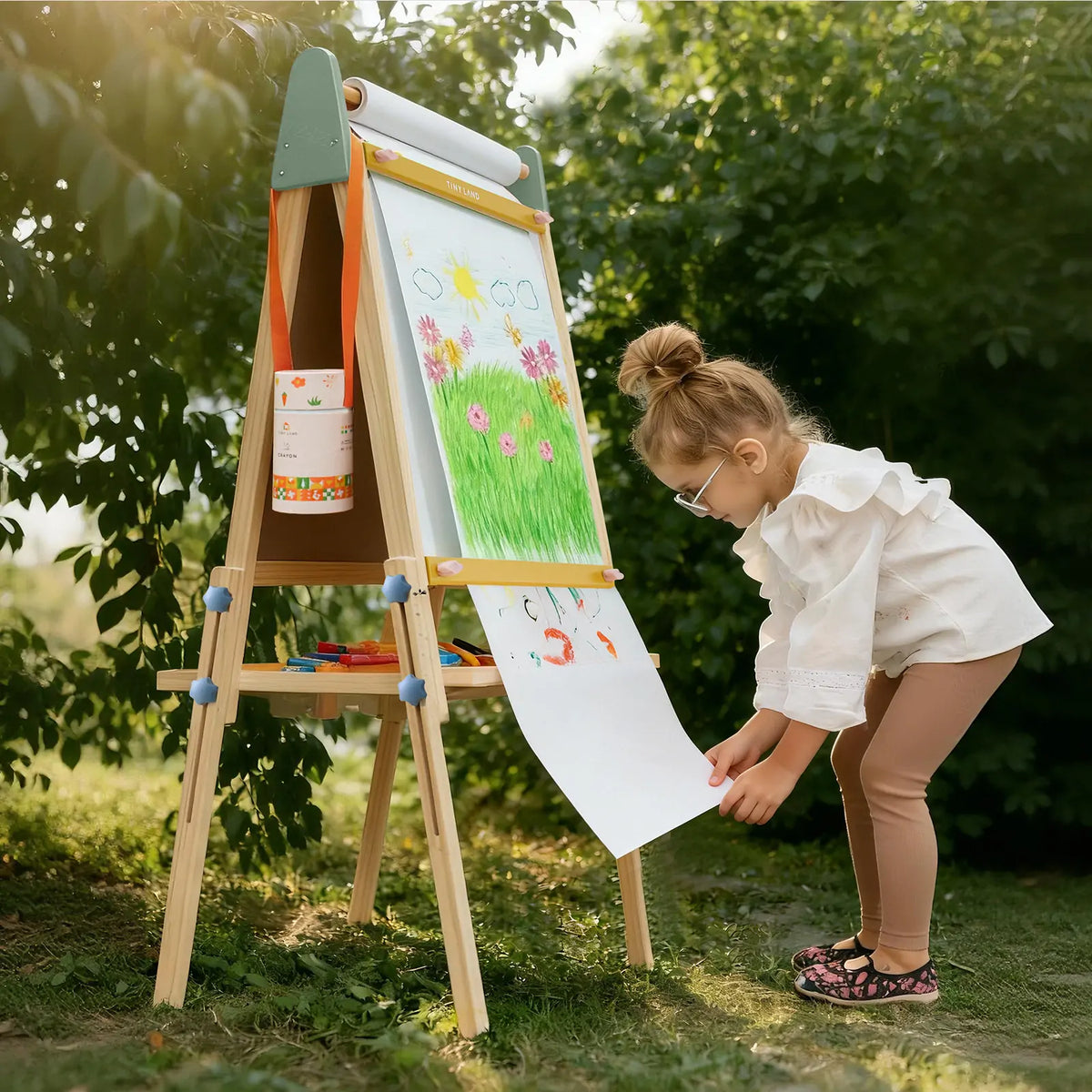 Tiny Land® 3-in-1 kids easel with chalkboard, whiteboard, and paper roll for creative art activities.