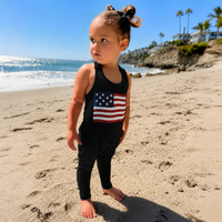 Black Americana romper by Be Mi Los Angeles, featuring a stylish, comfortable one-piece design with a relaxed fit and sleeveless style.