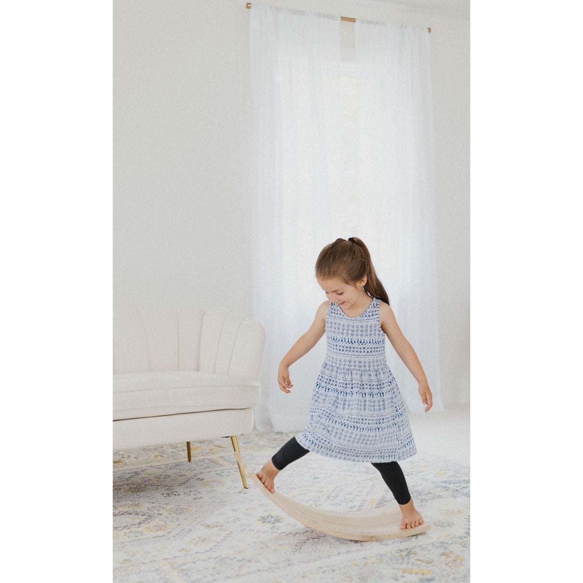 Children's balance board rocker toy from ShopMyLittleSongbird, featuring a colorful, curved wooden design for balance and fun.