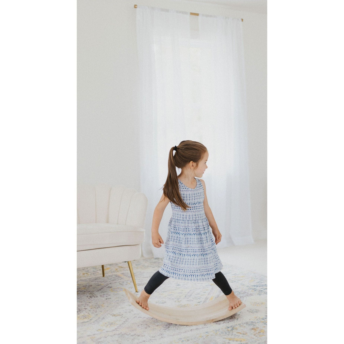Balance board rocker toy from ShopMyLittleSongbird, featuring a colorful, curved wooden platform for active play and balance development.