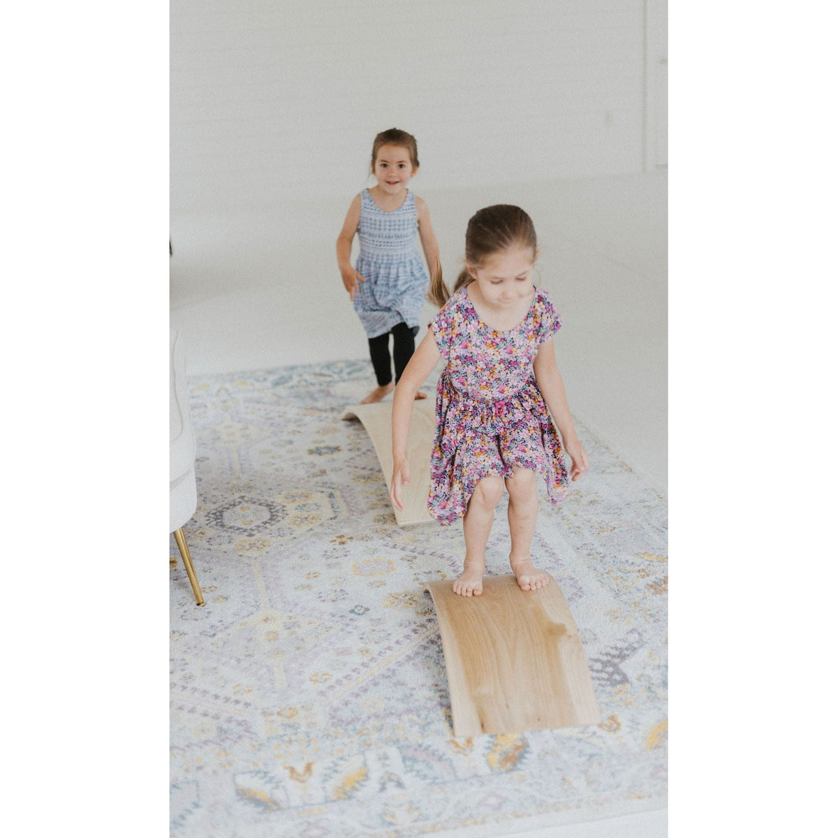 Children's balance board rocker toy by ShopMyLittleSongbird featuring a colorful, curved wooden design for active play.