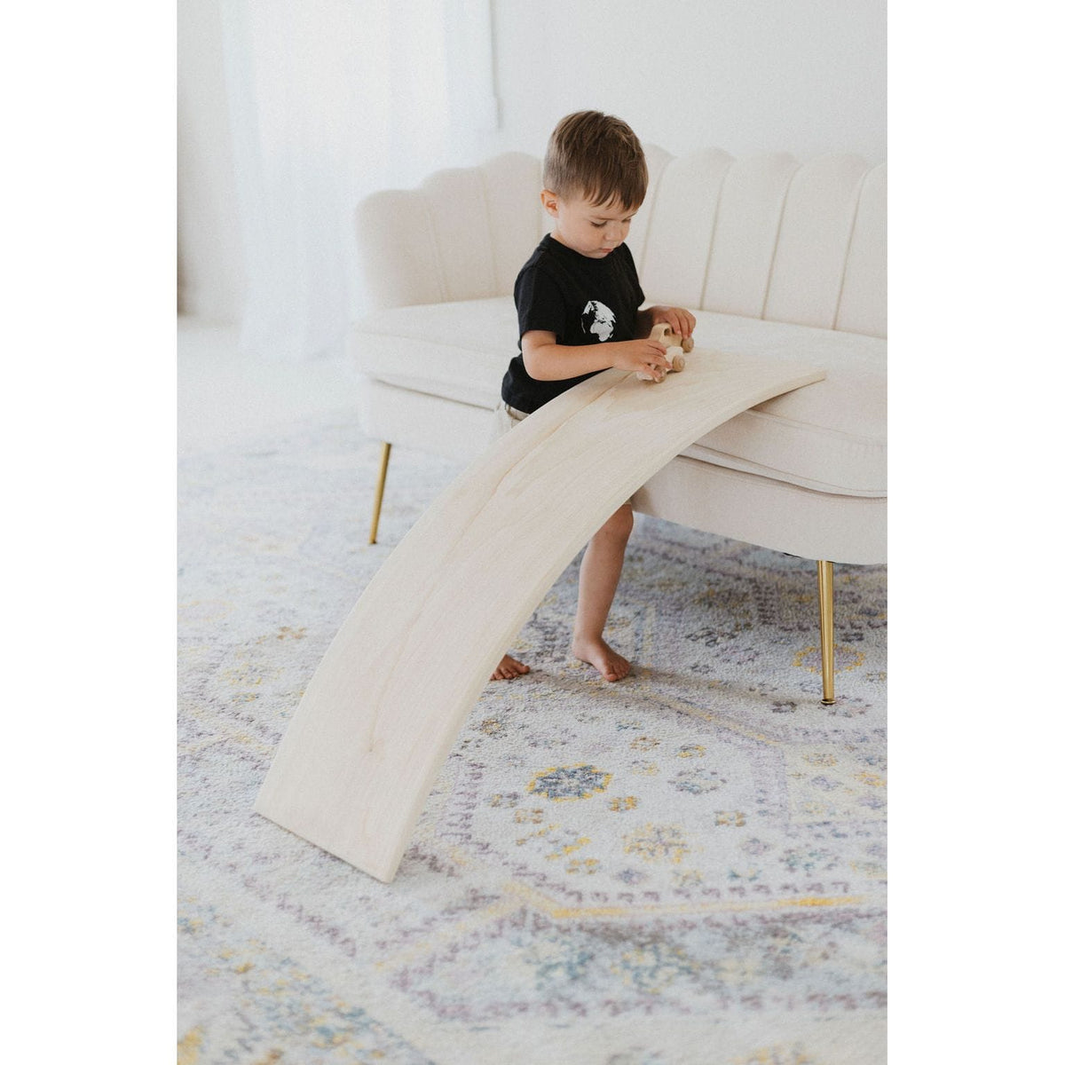 ShopMyLittleSongbird balance board toy with a wooden rocker surface for balance and coordination play.