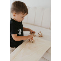 Colorful ShopMyLittleSongbird balance board toy with rounded edges and textured surface for safe, active play.