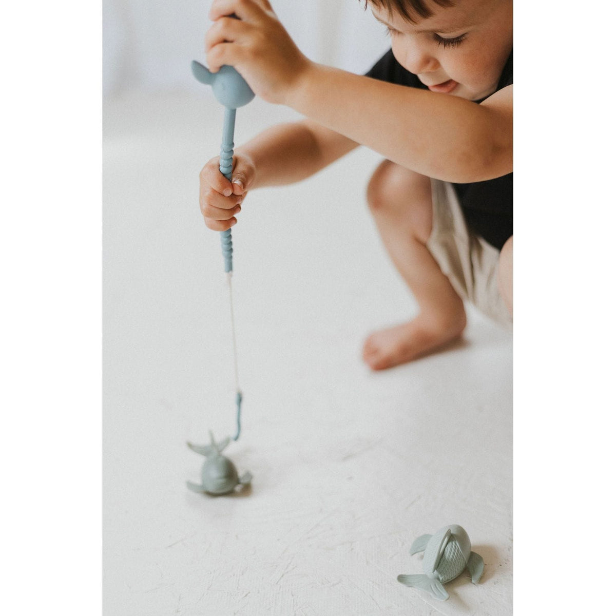 Colorful silicone fishing set toys for kids, featuring a variety of fishing rods and fish in vibrant silicone material.