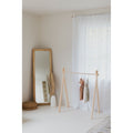 Wooden toddler clothes rack from ShopMyLittleSongbird featuring a lightweight, natural wood design for children's clothing organization.