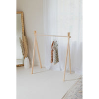 Wooden toddler clothes rack from ShopMyLittleSongbird, featuring a sturdy wooden frame and hooks for hanging small clothes.