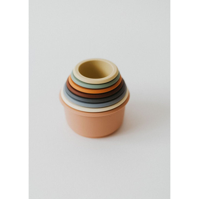 Colorful silicone stacking toy with multiple cups, designed for children to develop fine motor skills and coordination.