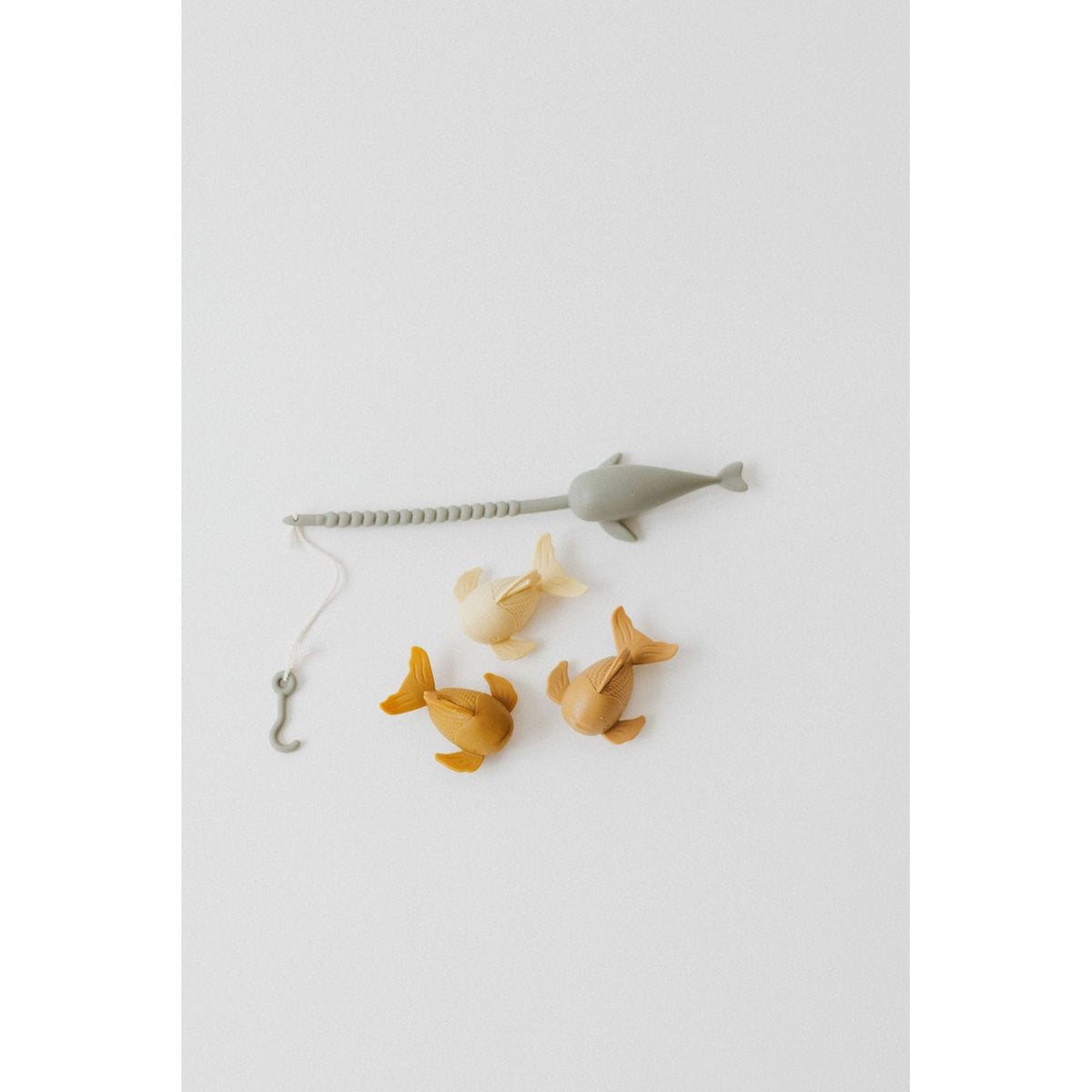 Colorful silicone fishing set with toy fishing rods and fish, designed for kids' play and learning.
