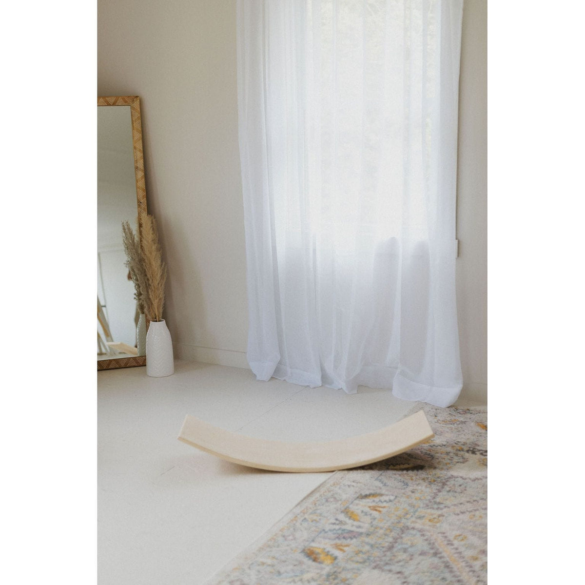 Children's balance board rocker toy by ShopMyLittleSongbird, featuring a colorful, curved wooden design for active play and balance.