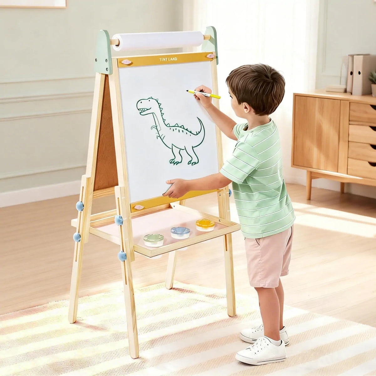 Tiny Land® 3-in-1 Kids Easel showing a colorful art surface, chalkboard, and paper holder for creative children's artwork.