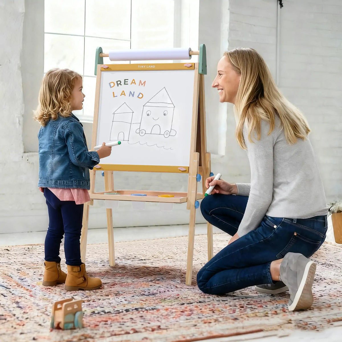 Tiny Land INC 3-in-1 kids easel with chalkboard, whiteboard, and paperholder for creative drawing and painting activities.