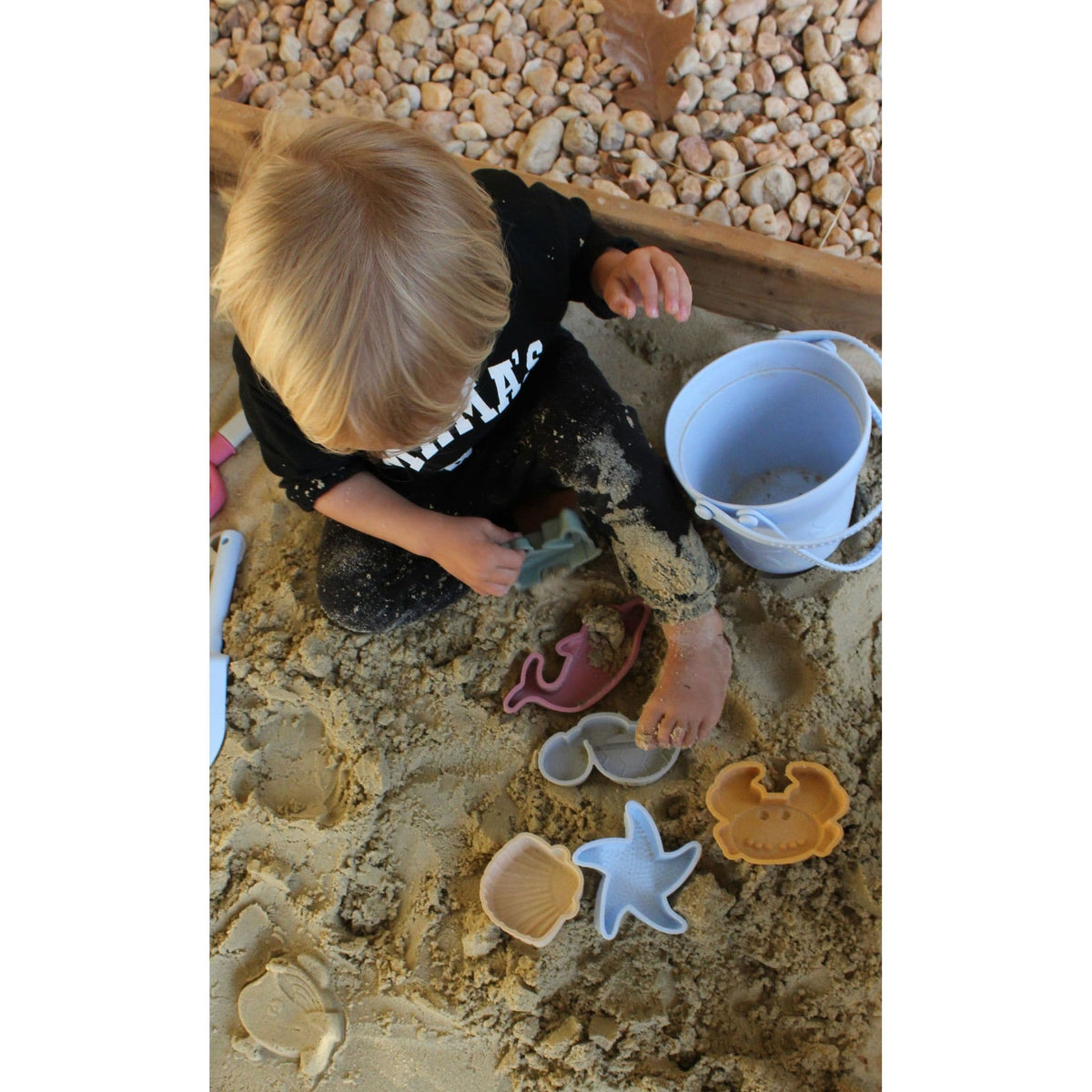 Colorful silicone sand toy bucket with toys and shovel set for kids, perfect for beach or sandbox play.