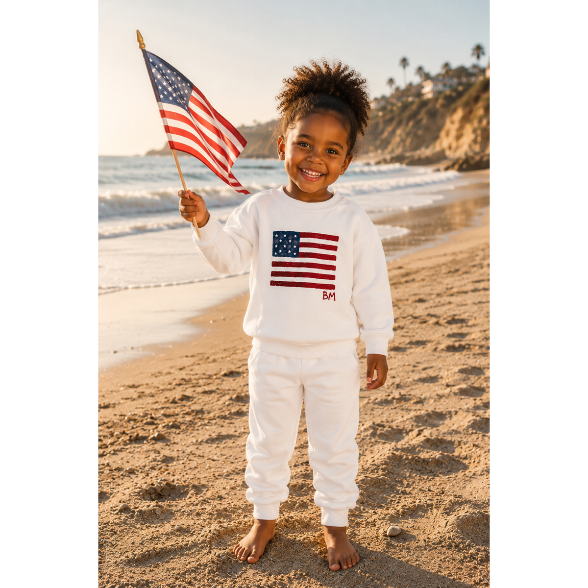 White organic cotton cloud flag pullover sweatshirt by Be Mi Los Angeles, featuring a soft, cozy design and cloud flag graphic.