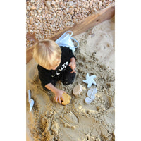 Silicone sand toy bucket with colorful toys and shovel for kids, ideal for outdoor play and sandcastle building.