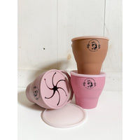 Collapsible silicone snack cups by ShopMyLittleSongbird, flexible and portable snack bowls for kids, with bright colors and smooth texture.
