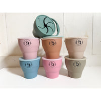 Silicone collapsible snack cup bowl from ShopMyLittleSongbird with a wide opening and flexible sides for easy snacking.