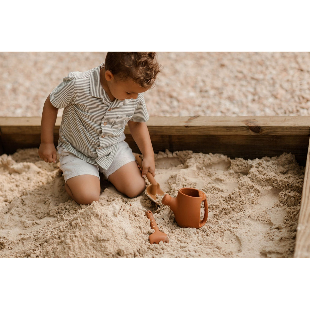 Colorful silicone watering can set for children, featuring soft, flexible toys perfect for imaginative play and water fun.