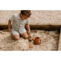 Colorful silicone watering can set for children, featuring soft, flexible toys perfect for imaginative play and water fun.