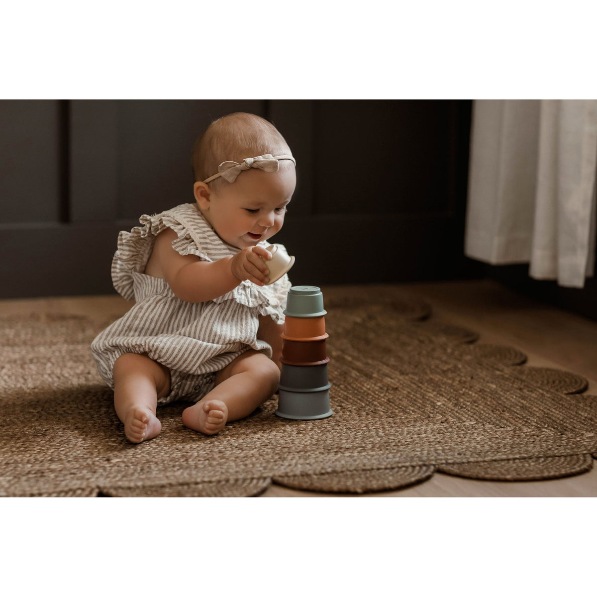 Colorful silicone stacking toy by ShopMyLittleSongbird with multiple cups for stacking and developing fine motor skills.