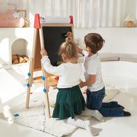 Kids easel from Tiny Land INC with a whiteboard, chalkboard, and paper roll holder for creative art activities.
