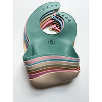 Silicone bib from ShopMyLittleSongbird with a colorful, waterproof design, featuring a pocket to catch crumbs during feeding.