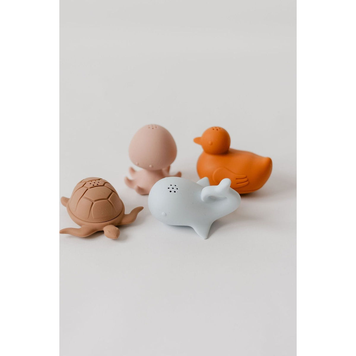 Colorful silicone bath toys for children, featuring playful shapes and bright designs, perfect for bath time fun.