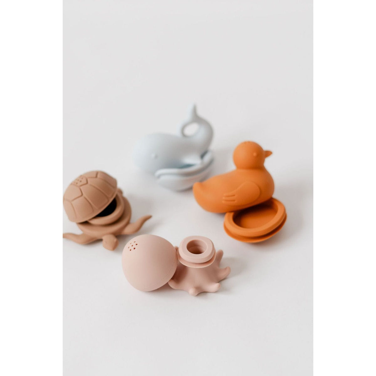 Colorful silicone bath toys for children, featuring playful shapes and bright designs, perfect for bath time fun.