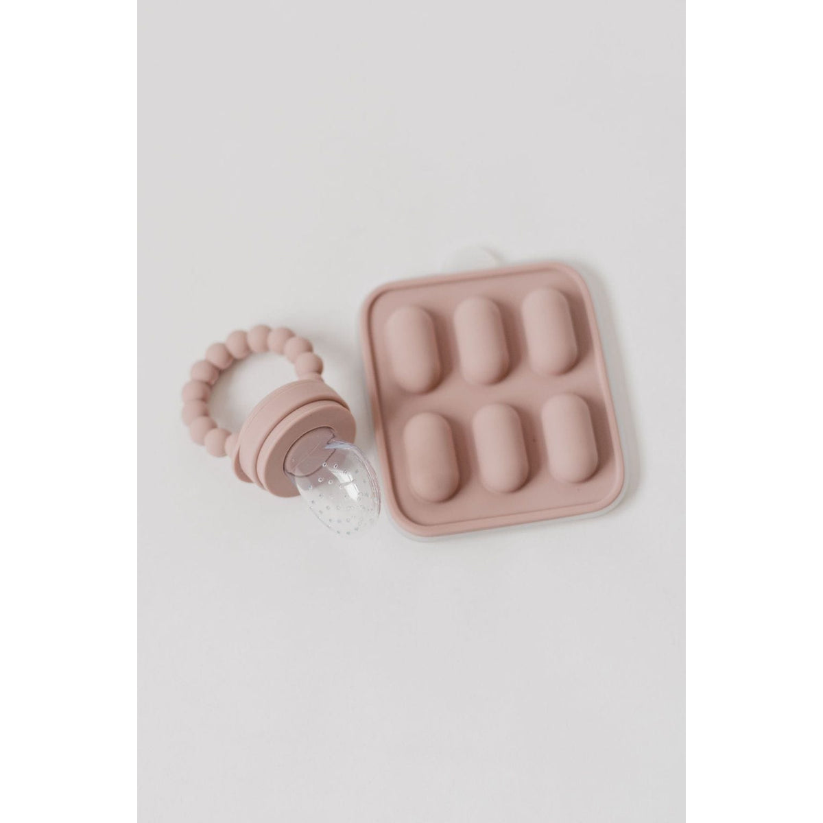 Silicone fruit feeder and ice tray set with colorful silicone molds for babies, easy to use and clean.