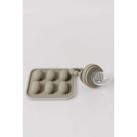 Silicone fruit feeder and ice tray set with colorful silicone parts, designed for safe feeding and ice making for babies.