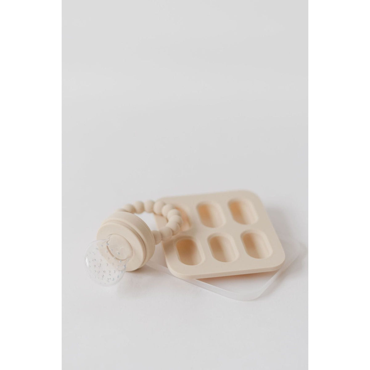 Silicone fruit feeder and ice tray set by ShopMyLittleSongbird, featuring colorful silicone tools for feeding and freezing fruit.