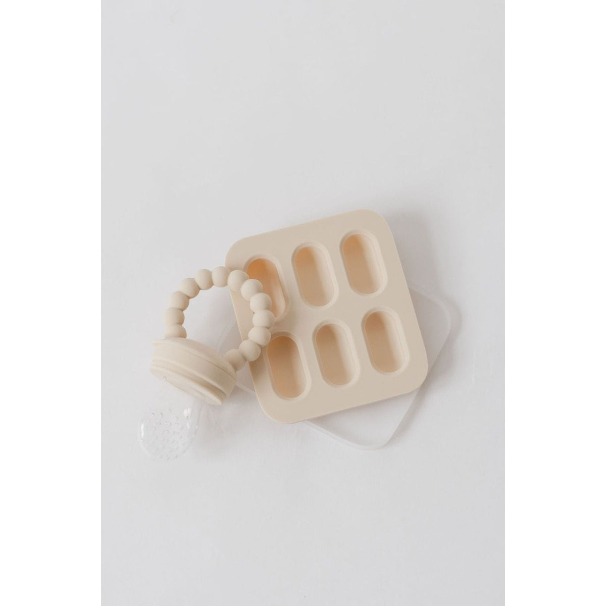 Silicone fruit feeder and ice tray set by ShopMyLittleSongbird, featuring colorful fruit-shaped silicone molds and a feeder for babies.