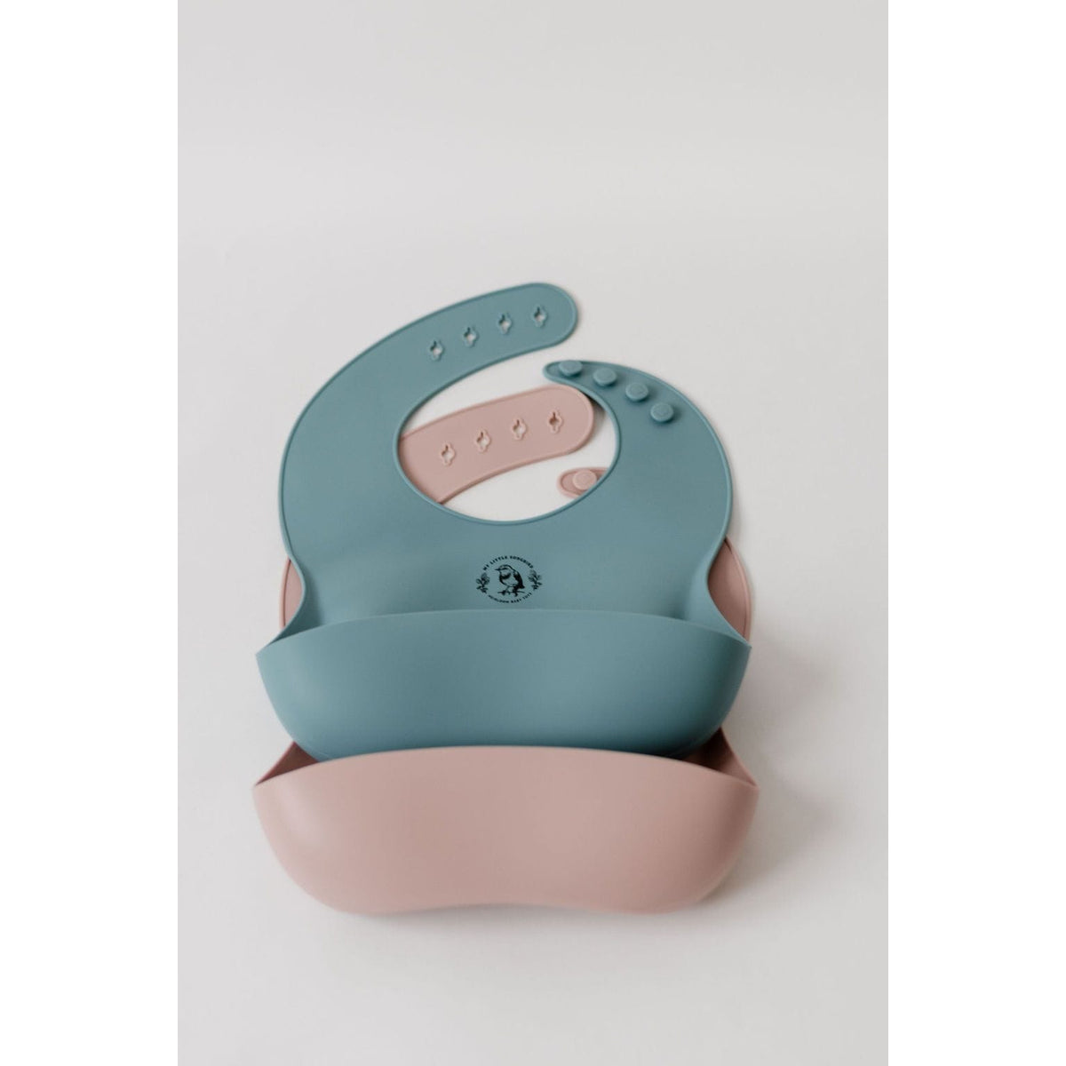 Silicone bib by ShopMyLittleSongbird with adjustable neck strap and colorful design, ideal for feeding babies and toddlers.