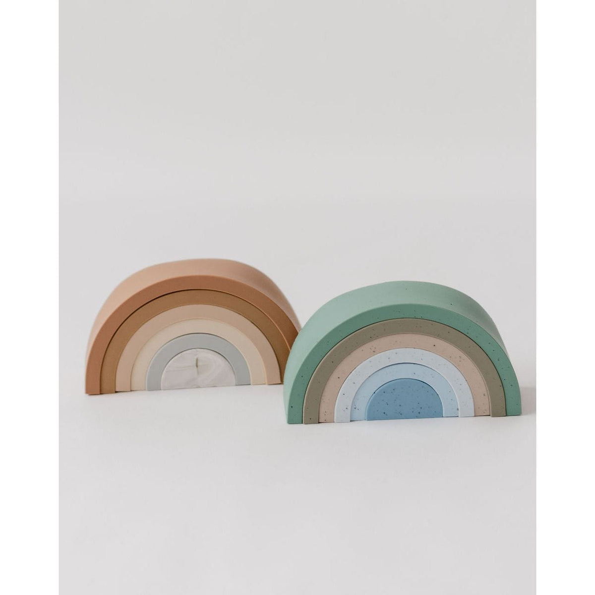 Colorful silicone stacking rainbow toy by ShopMyLittleSongbird with vibrant arcs for developmental play and sensory exploration.