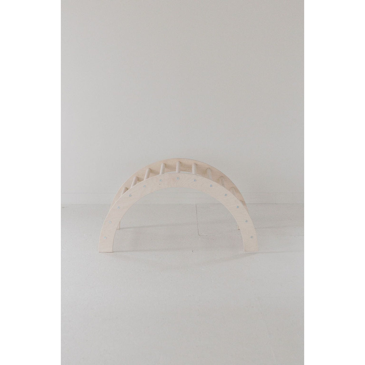 Colorful arch tunnel gym for babies and toddlers, soft fabric and play arches designed for safe, interactive play.