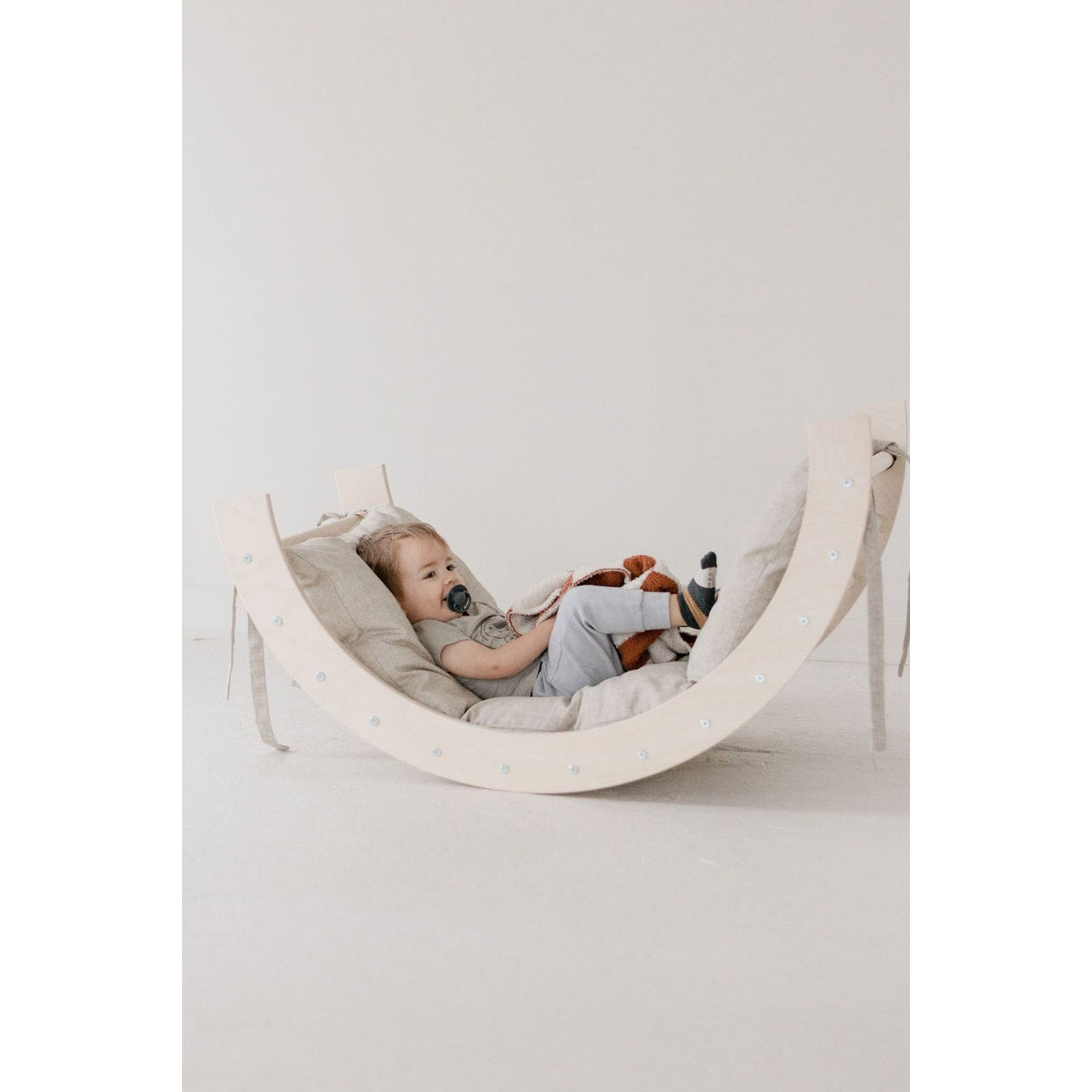 Colorful arch tunnel gym for kids, soft fabric play tunnel with multiple arches for crawling and crawling fun.