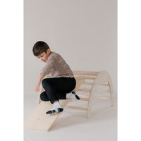 Colorful arch tunnel gym for toddlers, featuring soft fabric and multiple openings for crawling and play.