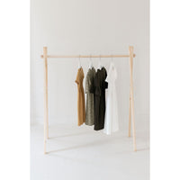 Wooden toddler clothes rack from ShopMyLittleSongbird, featuring a sturdy wooden frame and hooks for hanging children's clothing.