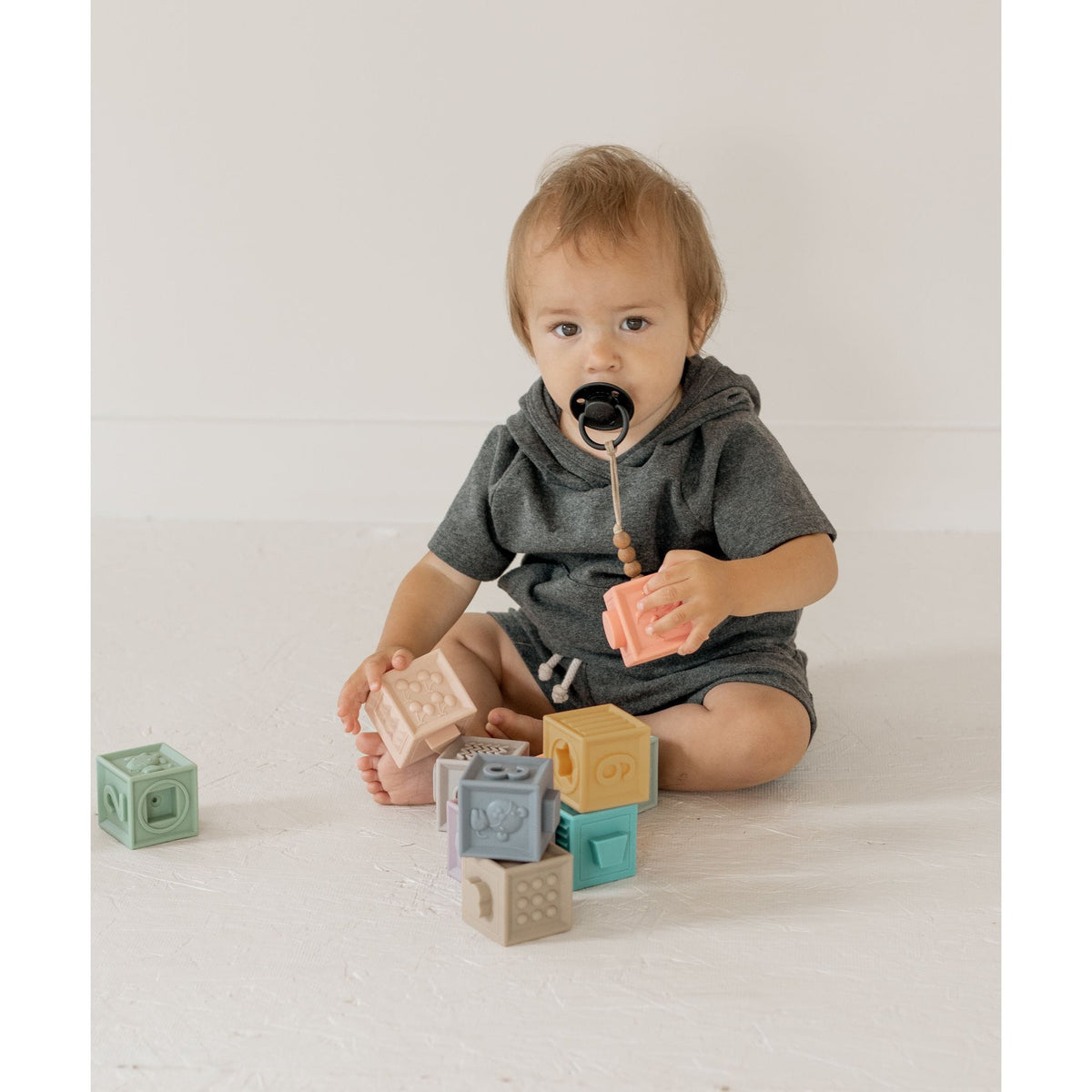 Colorful silicone blocks set for children, featuring numbered and lettered shapes for educational play, by ShopMyLittleSongbird.