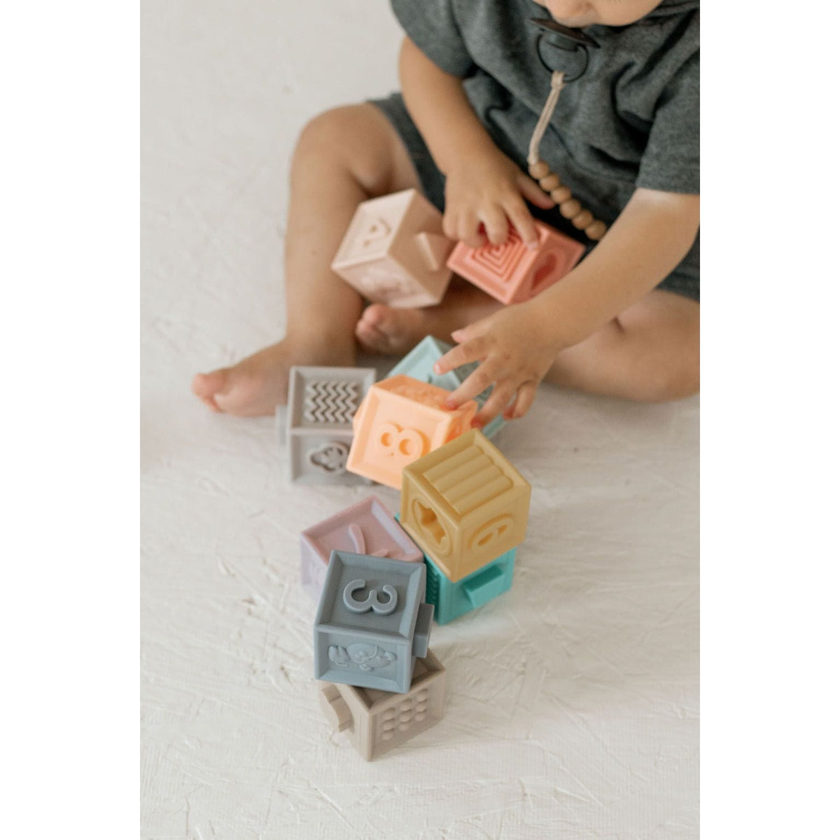 Colorful silicone blocks toy set with numbered and lettered blocks for early learning and play.